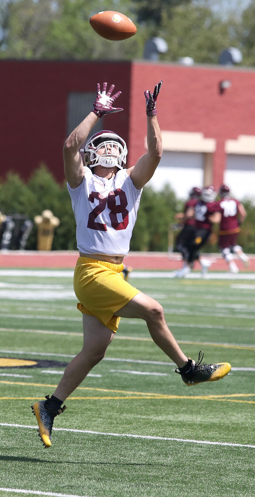 Bulldog defensive back Zach Wallace (28) jumps to make a catch
