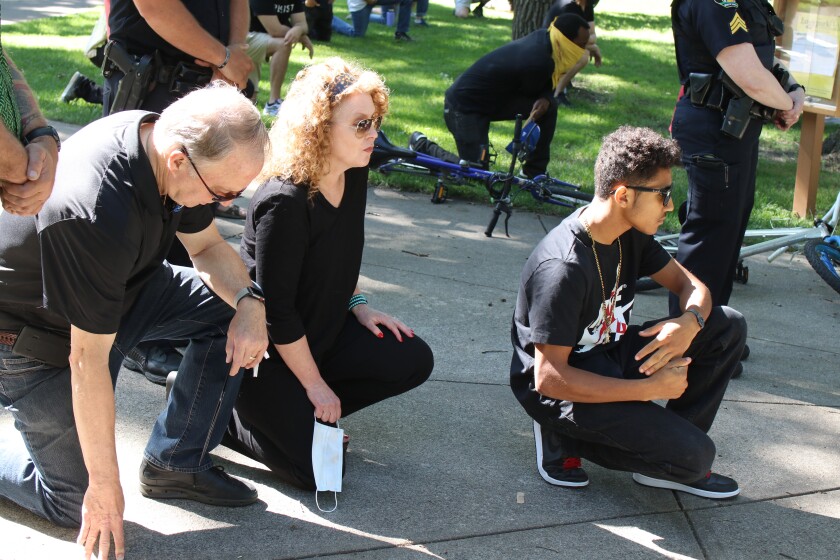 Mayor Tim Mahoney and family kneeling during 8 minutes and 46 seconds of silence for George Floyd during Juneteenth protest..jpg