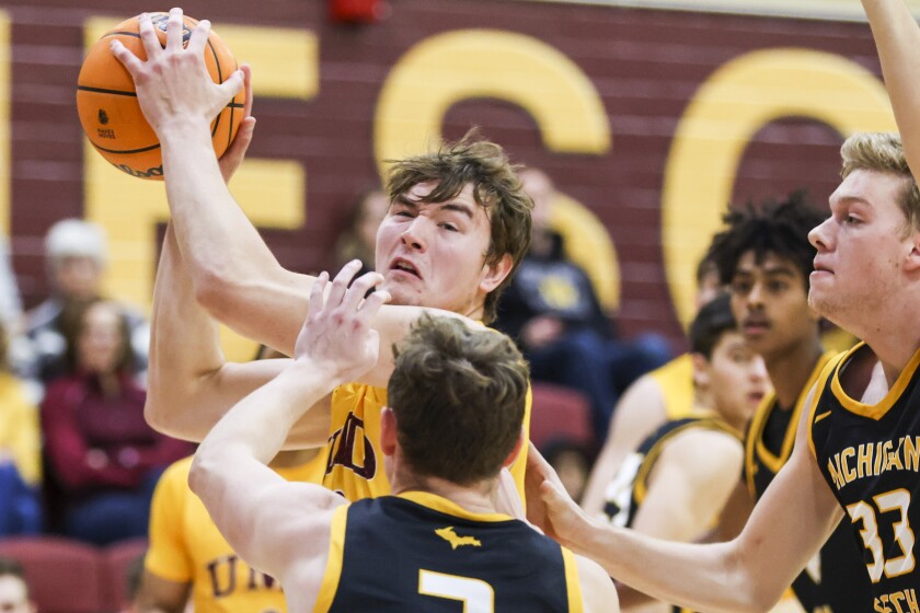 college men playing basketball
