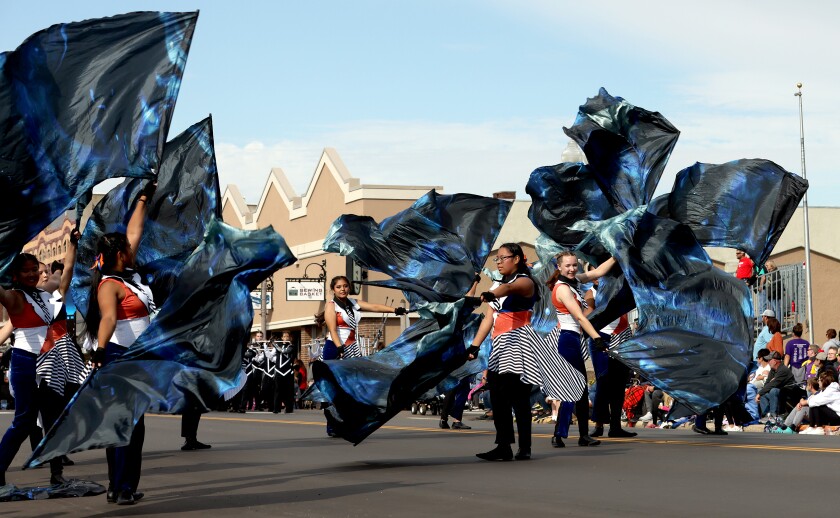 The Spirit of Worthington Trojan Marching Band color guard participates in the 71st Luverne Tri-State Band Festival on Saturday, September 24, 2022.