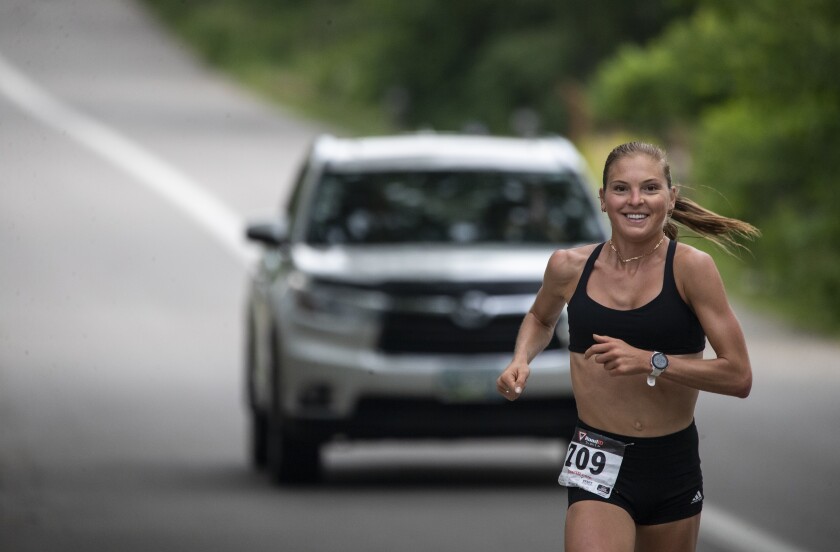 Jessa Hanson keeps a solid pace while competing in the Green Lake Road Race in Spicer on the morning of Sunday, June 3, 2022. Hanson would eventually go on to finish first in the women's division of the 12-mile race.