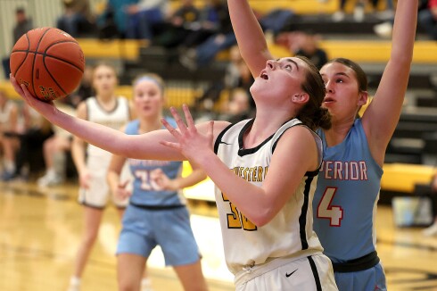 Player shoots ball.
