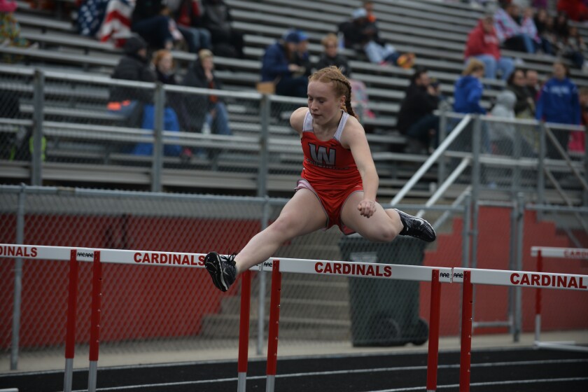 Willmar's Amy Linden clears a hurdle during the 100 meter hurdles on Thursday at the Willmar Invitational at Hodapp Field. Curt Hogg / Tribune