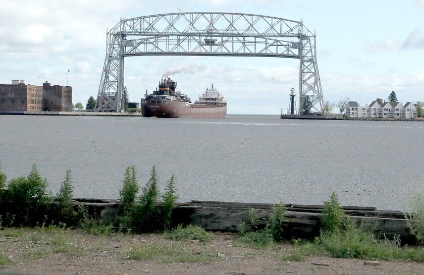The Hon. James L.
/p
pOberstar can be seen leaving under the Aerial Lift Bridge from Jeff Foster Trucking's Duluth Harbor Industrial Park property