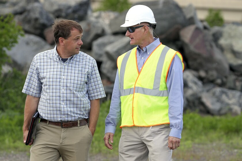 Two men talking.