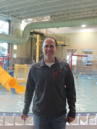 James Kramer, director of the Dickinson Parks and Recreation Department, stands before the West River Community Center's indoor pool. (Iain Woessner/The Dickinson Press)