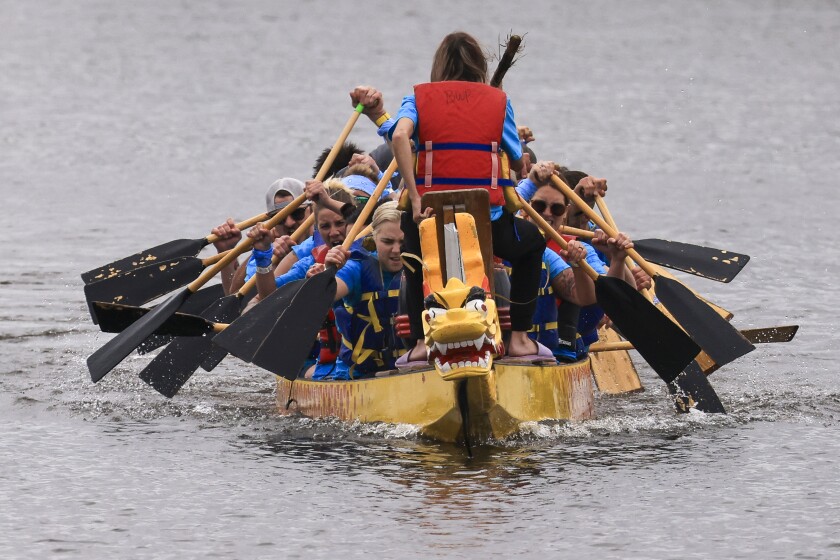 Dragon boat racing practice on a warm spring morning at Lake