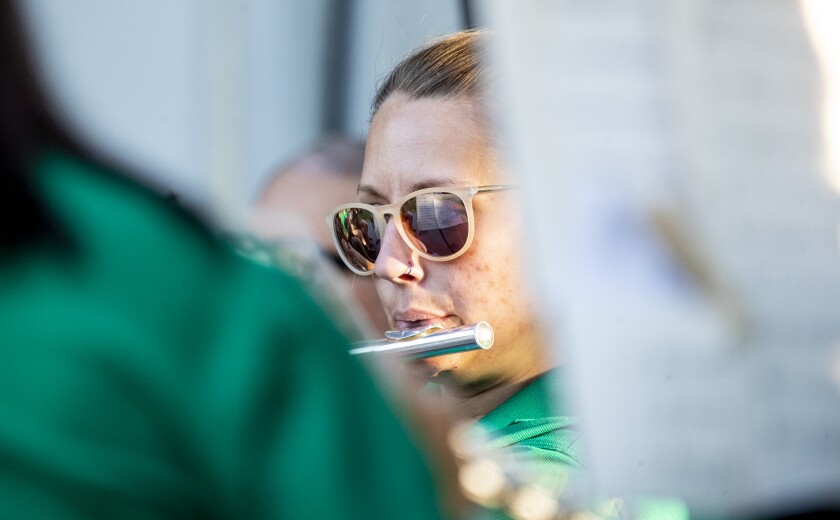 A member of the Prairie Winds Summer Band performs to the crowd during festivities at Rice Park on Wednesday, June 22, 2022.