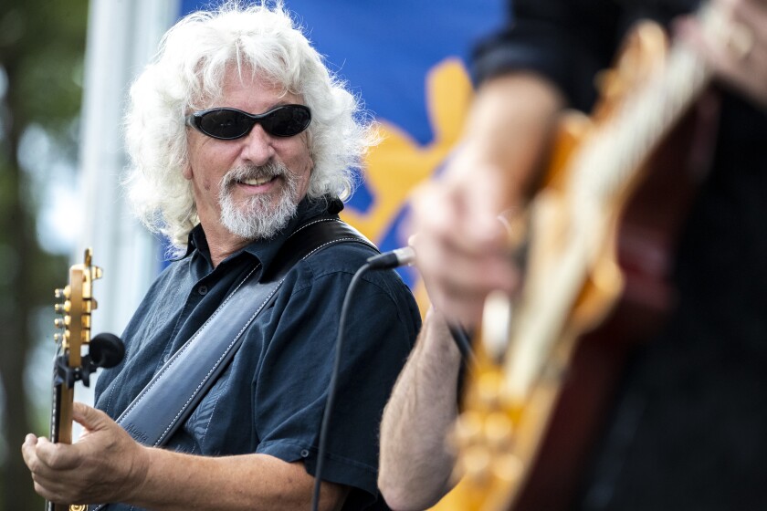 Xpedition bassist Tom Dario plays with his bandmates during the first Rockin' Robbins event of the summer season at Robbins Island Regional Park in Willmar on Tuesday, July 12, 2022.