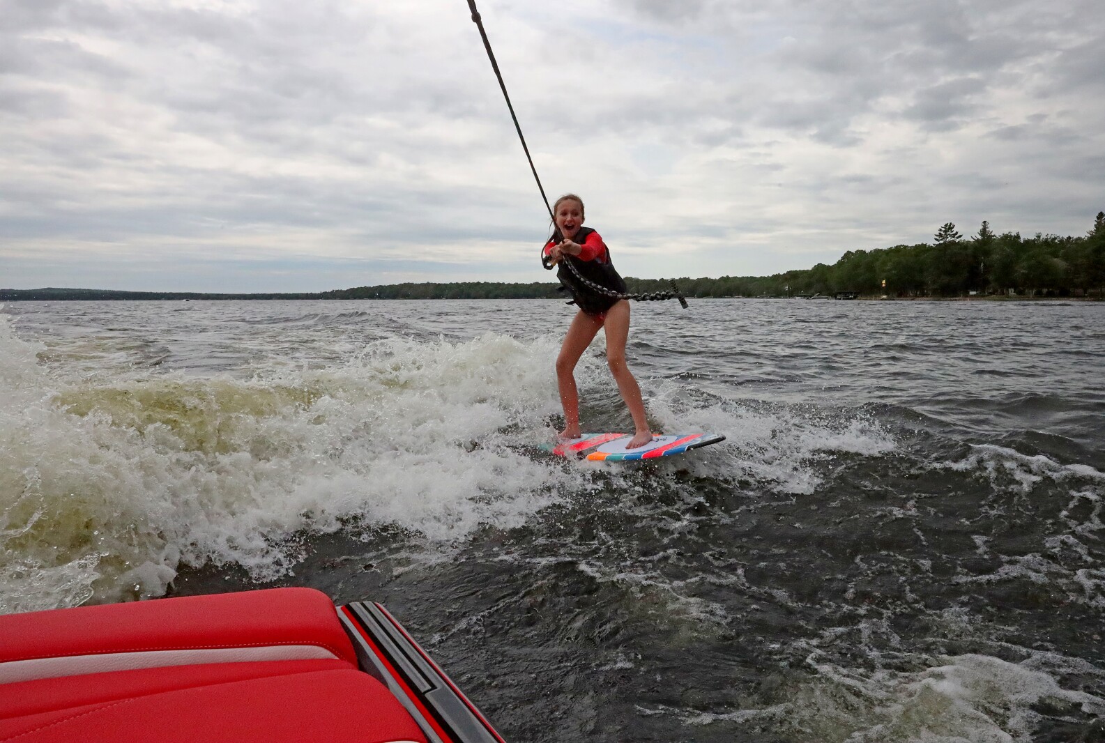 Savannah Mendell demonstrates wake surfing for people during the ninth annual Bar Harbor In-Water Boat Show on Saturday, June 18, 2022, on Gull Lake. Watercraft for the boat show were brought by Nisswa Marine and Minnesota Inboard Water Sports and a Wake Responsibly event taught attendees boat safety and responsibility.