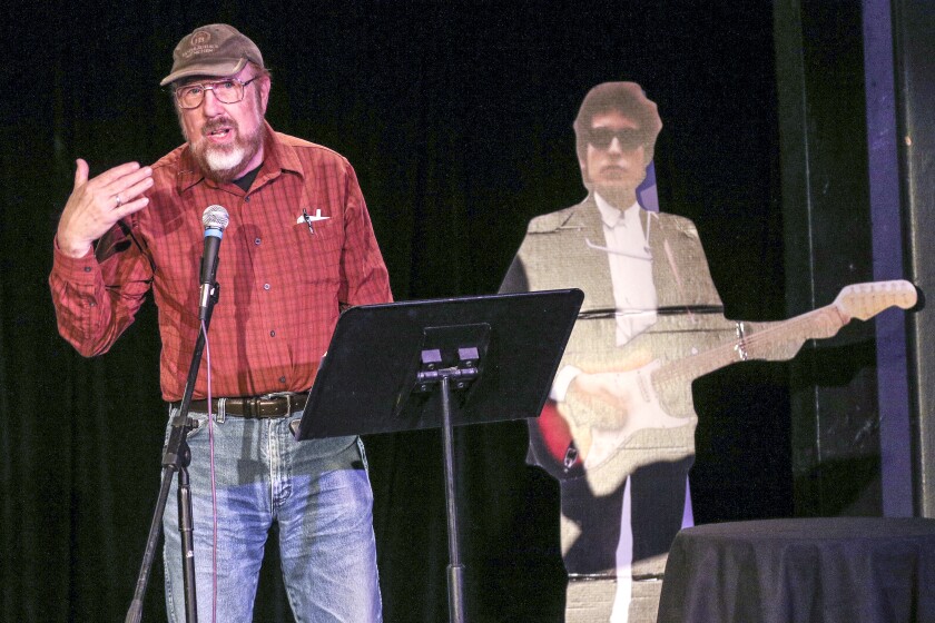 Poet David Pichaske reads a poem from "Visiting Bob: Poems Inspired by the Life and Work of Bob Dylan" during the Duluth Dylan Fest at Zeitgeist Teatro Zuccone in Duluth on Wednesday evening. Clint Austin / caustin@duluthnews.com