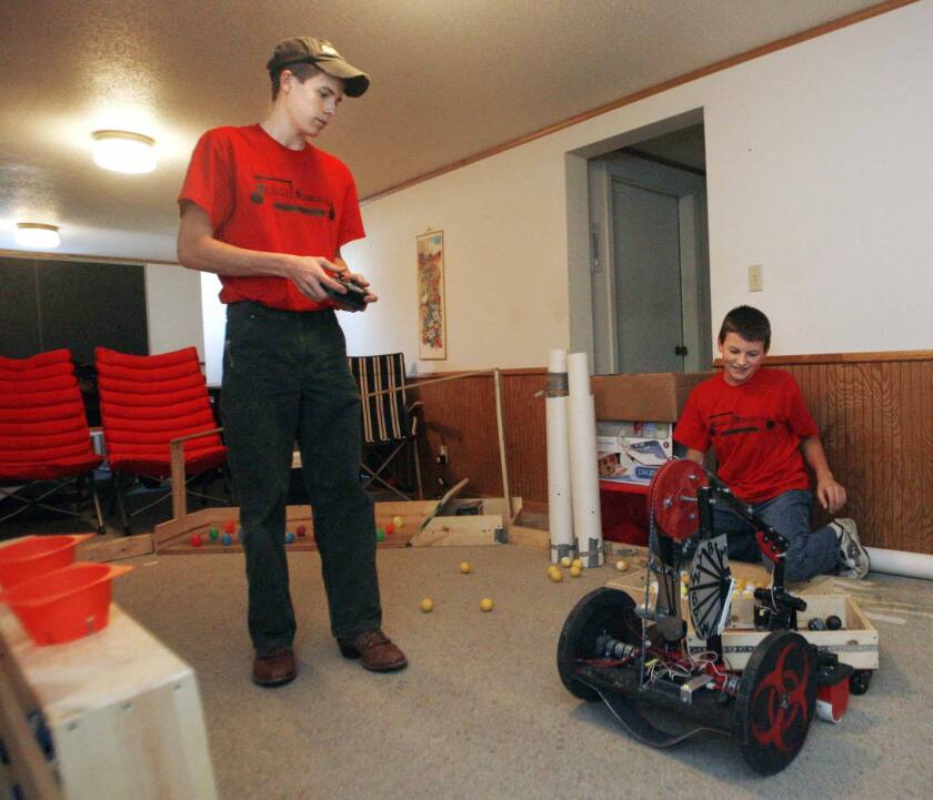 Students look over their robot