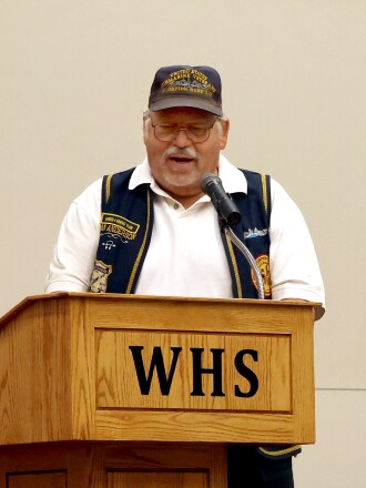 Dan Anderson, a Navy submariner from 1972-1992, gives the Memorial Day address at the Worthington High School Monday morning.