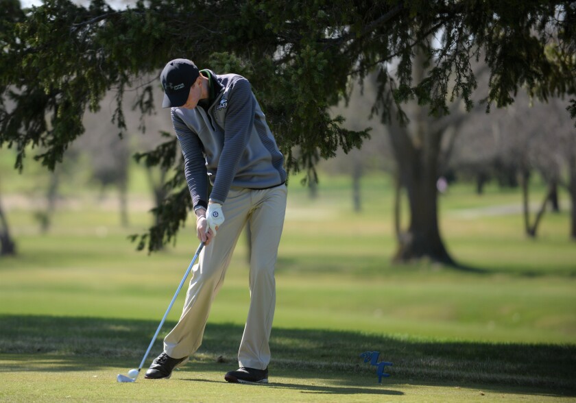 Willmar Community Christian's Greg Reid tees off in Friday's New London-Spicer Invitational at Little Crow Country Club. Jake Schultz / Tribune