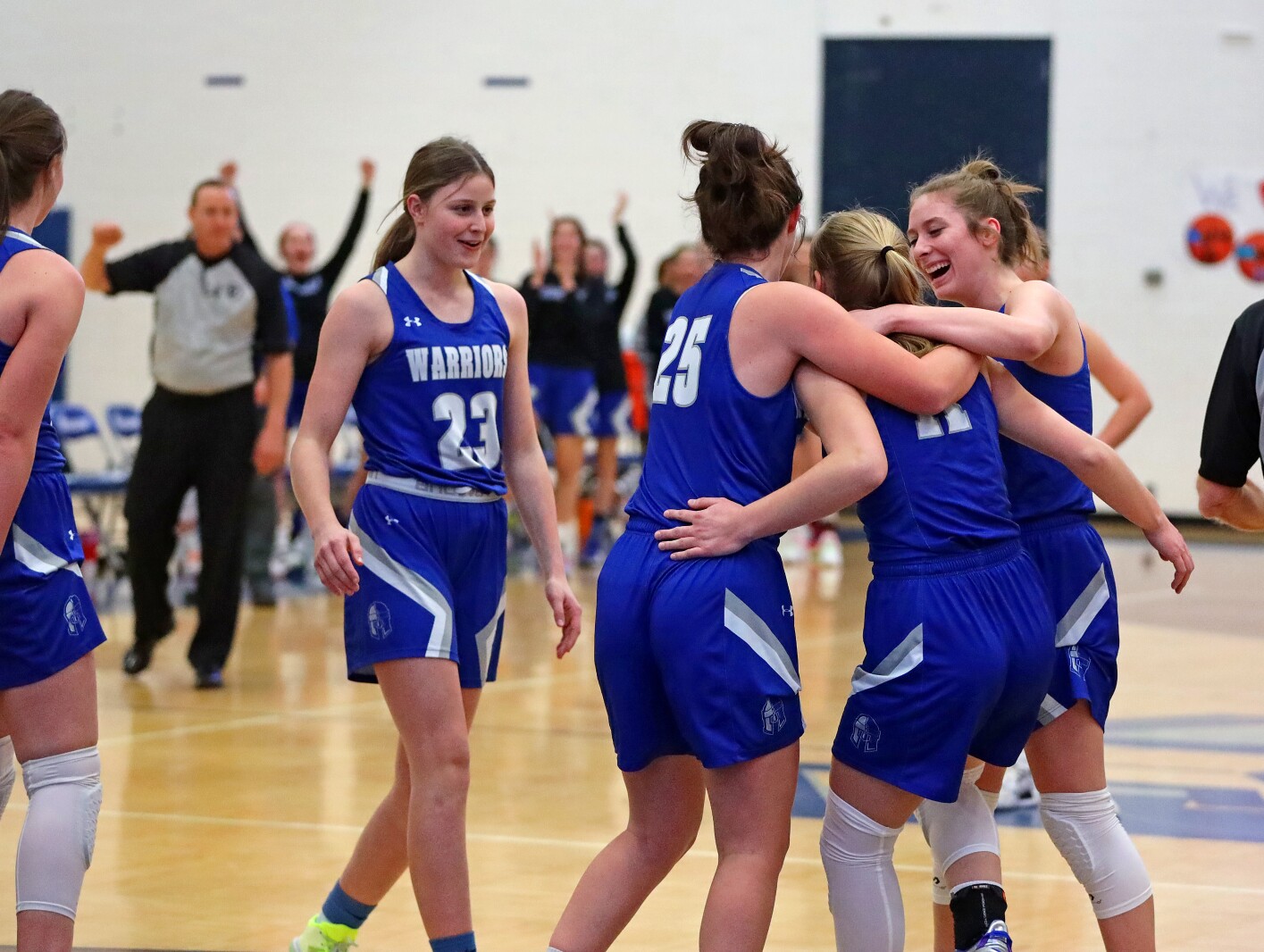 The Brainerd girls basketball team celebrates Myah Nelson getting her 1000th point.