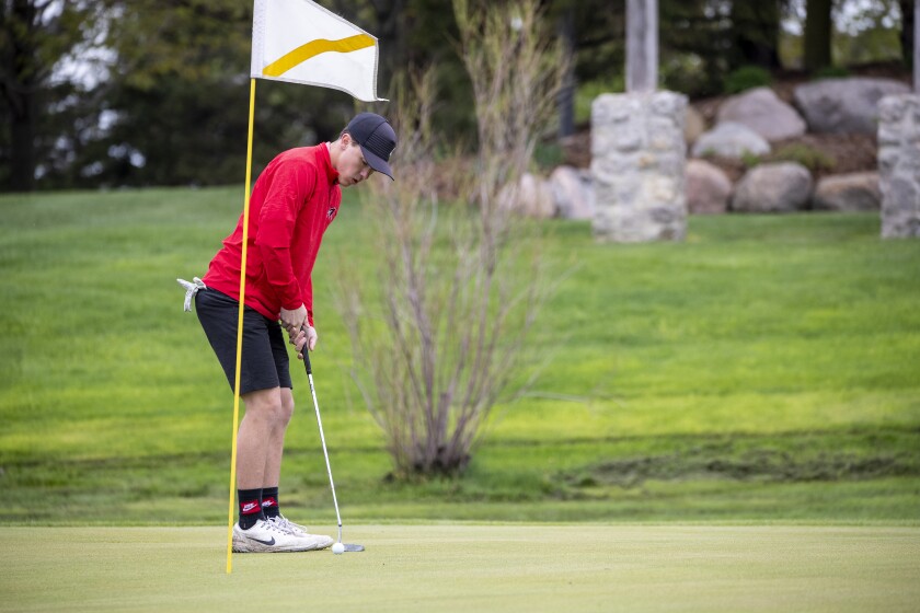 Justuce Gee of Willmar High School putts the ball while competing in the boys varsity conference championship at Eagle Creek Golf Course in Willmar on Friday, May 20, 2022.