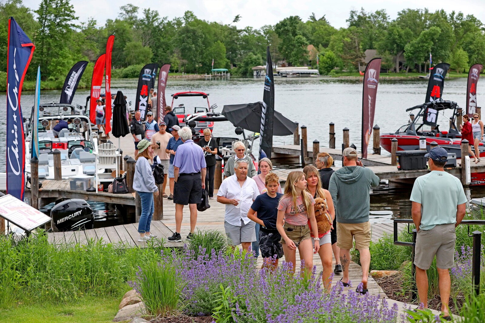 People gather for the ninth annual Bar Harbor In-Water Boat Show on Saturday, June 18, 2022, with boats from Nisswa Marine and Minnesota Inboard Water Sports at the Bar Harbor Supper Club on Gull Lake.