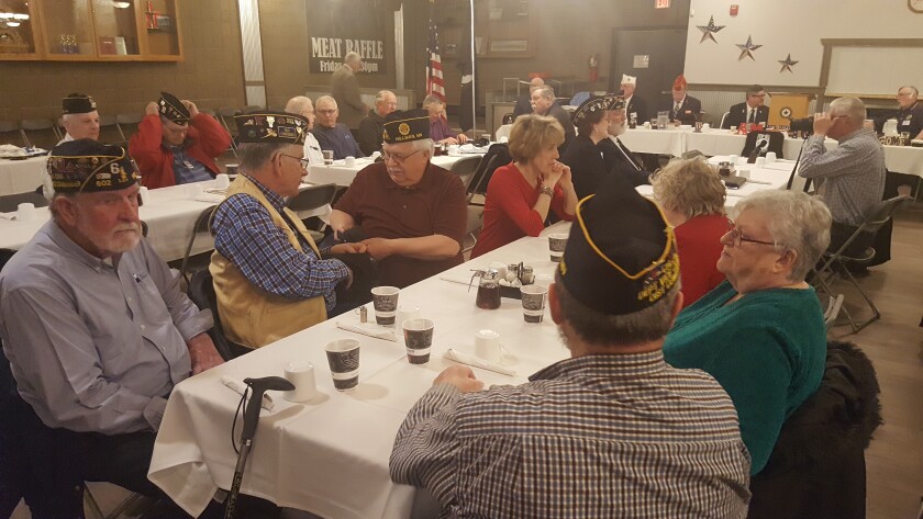 Members of the Brainerd American Legion chapter mingle during a ceremonious breakfast the morning of Tuesday, March 12, at Legion Post 255 on 708 Front St. Members of the Legion welcomed National Commander Brett Reistad during the 100th year of the veterans organization. Gabriel Lagarde / Brainerd Dispatch