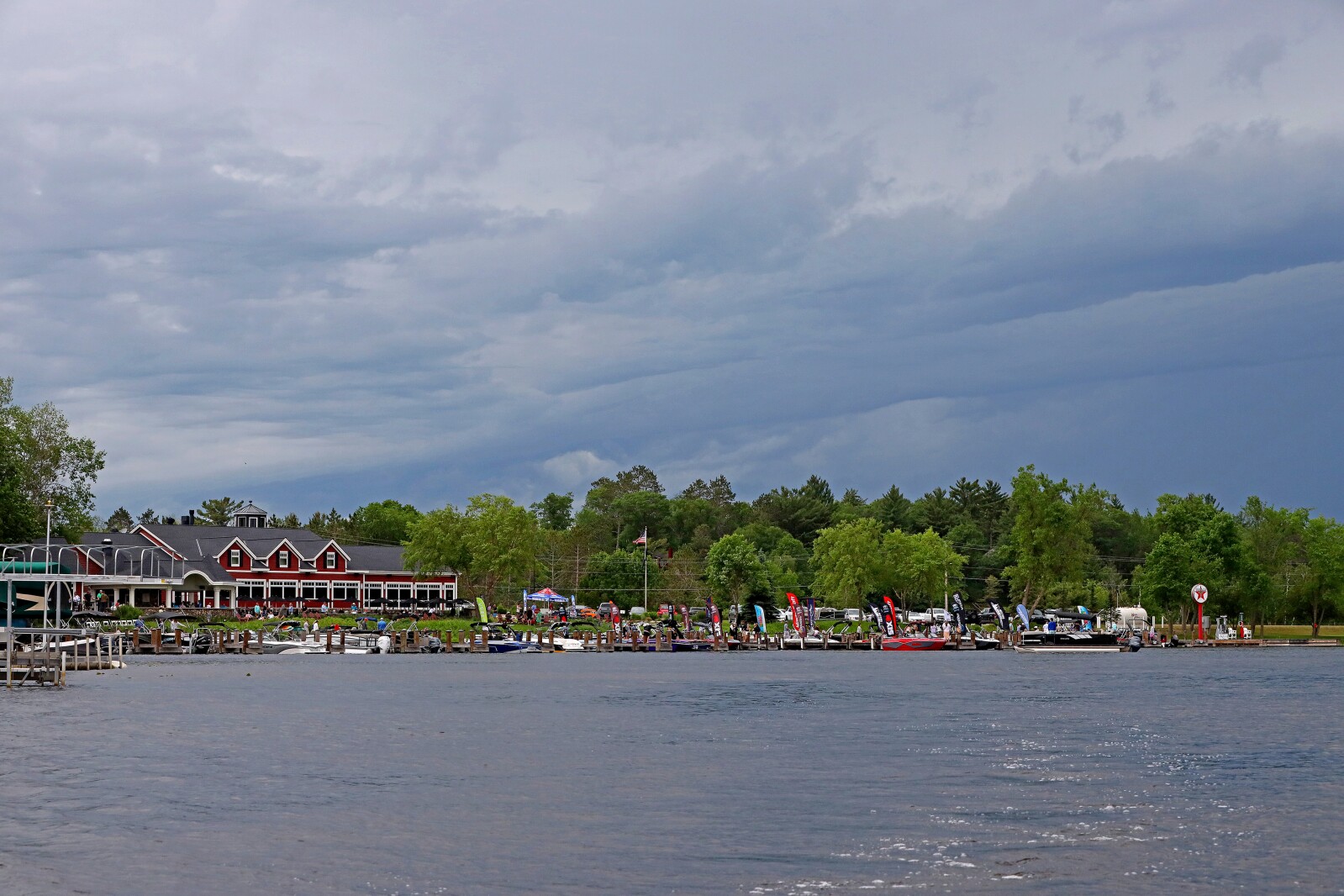 People gather for the ninth annual Bar Harbor In-Water Boat Show on Saturday, June 18, 2022, with boats from Nisswa Marine and Minnesota Inboard Water Sports at the Bar Harbor Supper Club on Gull Lake.