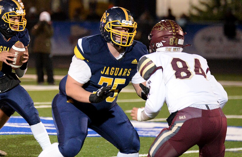 RCW senior Noah Gullickson, 75, pass blocks Hancock's Weston Nohl during the Section 2 Nine-Man championship game on Friday, Nov. 4, 2022 at Lakeview High School in Cottonwood.