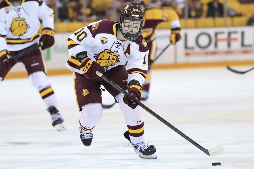 college men play ice hockey