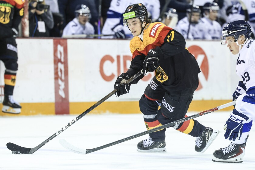 men play ice hockey