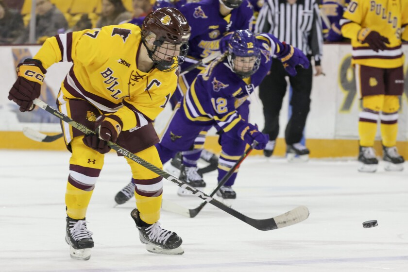 Women's college hockey teams play game in arena