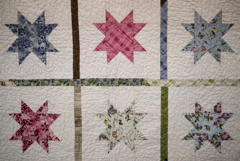 A completed quilt sits on display at Paynesville-based quilt business, Sweetwater Cotton Shoppe, on Thursday, July 28, 2022.