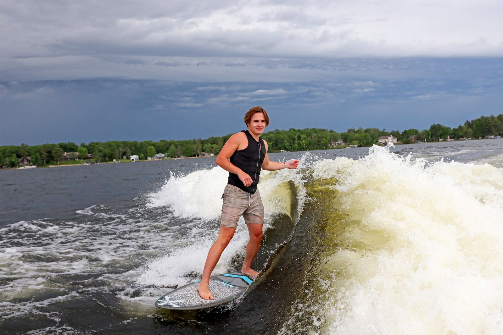 Parker Linn demonstrates wake surfing for people during the ninth annual Bar Harbor In-Water Boat Show on Saturday, June 18, 2022, on Gull Lake. Watercraft for the boat show were brought by Nisswa Marine and Minnesota Inboard Water Sports and a Wake Responsibly event taught attendees boat safety and responsibility.