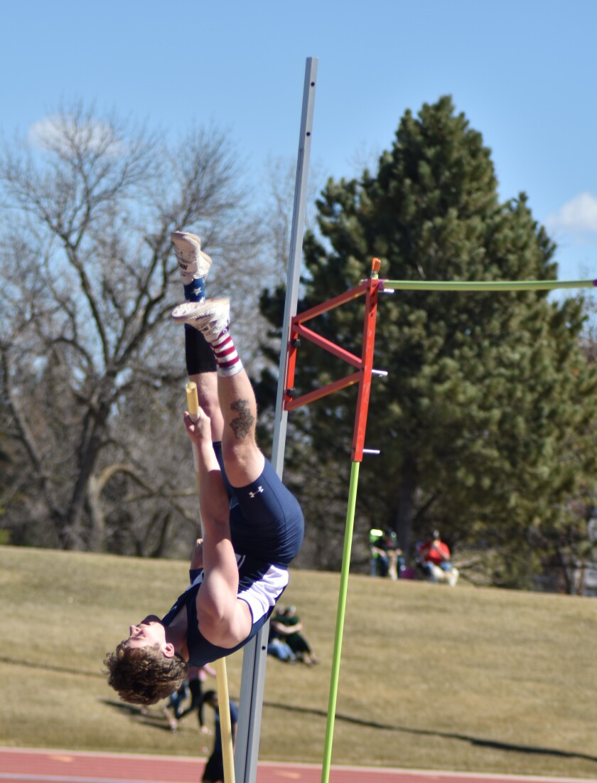 Dickinson State sophomore Hoyt Zander soars over the bar while competing in pole vault at the Blue Hawk Games on Friday, April 19, at the Biesiot Activities Center. (Shelby Reardon / The Dickinson Press)