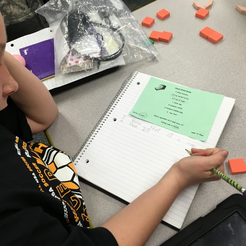 Macey Linke works on an assignment that uses a recipe to teach fractions last week at Gertie Belle Rogers Elementary School in Mitchell. (Candy DenOuden/Republic)
