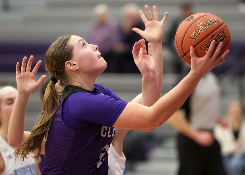 Player shoots ball.