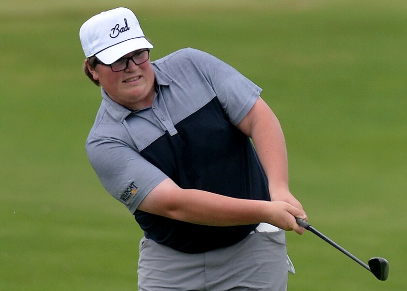 NLS senior Noah Dietz watches as his chip attempt gets on the green on hole No. 18 at Ridges at Sand Creek during Day 2 of the Class AA state golf championships on Wednesday, June 15, 2022 at Jordan.