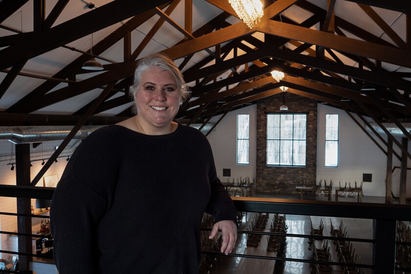 011722.B.FF.LONEOAK-mezzanine_2.jpg Teresa Gulleson, co-owner of Lone Oak Farm, stands in the mezzanine overlooking the main hall.
