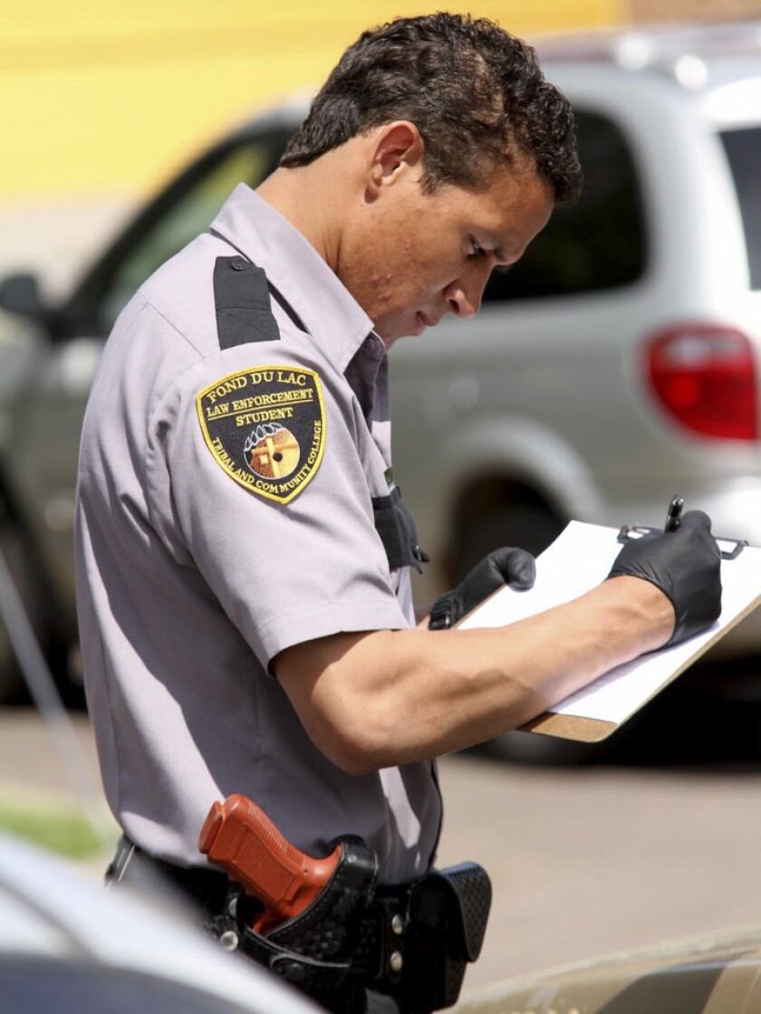 Student practices writing a ticket.