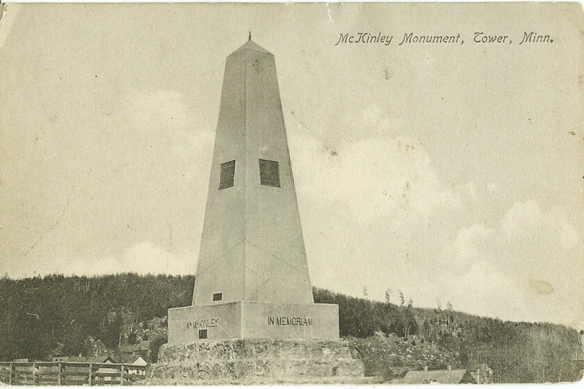 An old black-and-white photo of an obelisk.