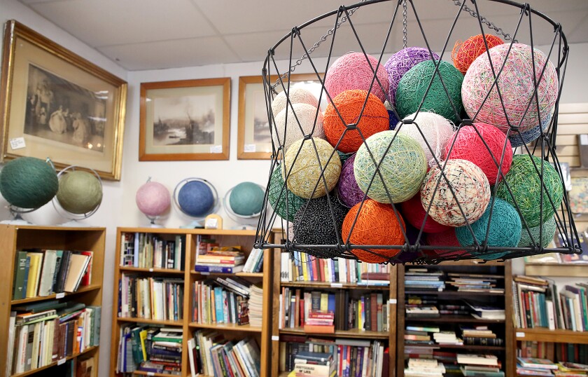 Balls of string in a bin.