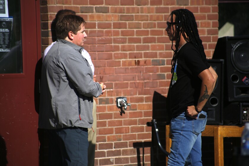 A woman talking with a man.
