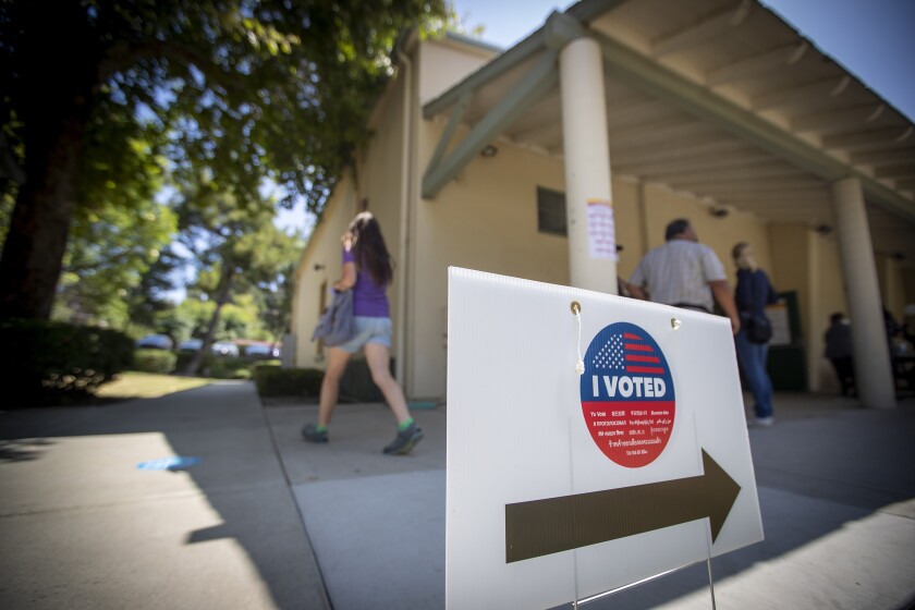 A voter exits after casting their ballot in the California primary at The Park in La Habra Heights Tuesday, June 7, 2022.