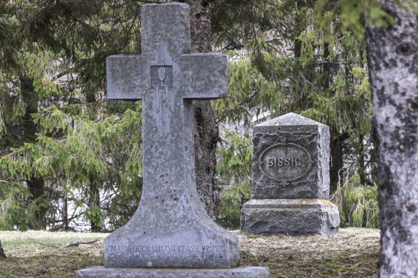 woman documents gravestones
