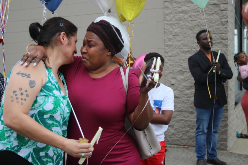 Antonia Johnson, mother of Daisy Jupiter Paulsen, being comforted by a member of the Liberian Community on June 25, 2021.jpg
