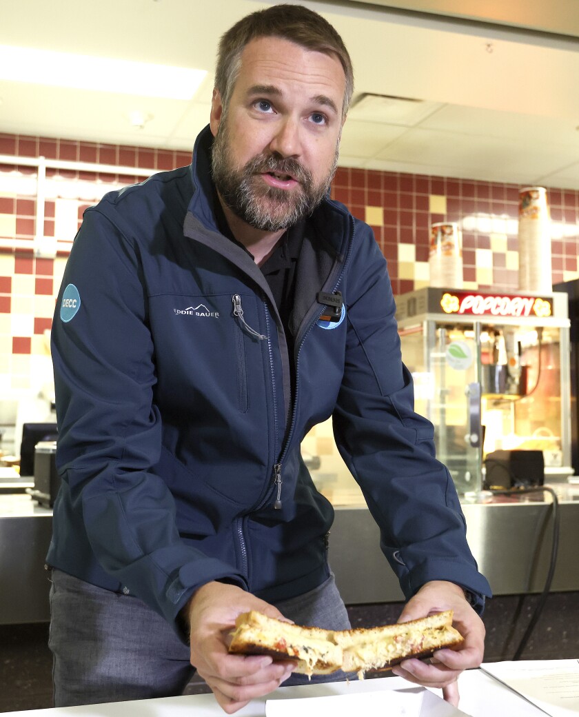 Man holding a sandwich.