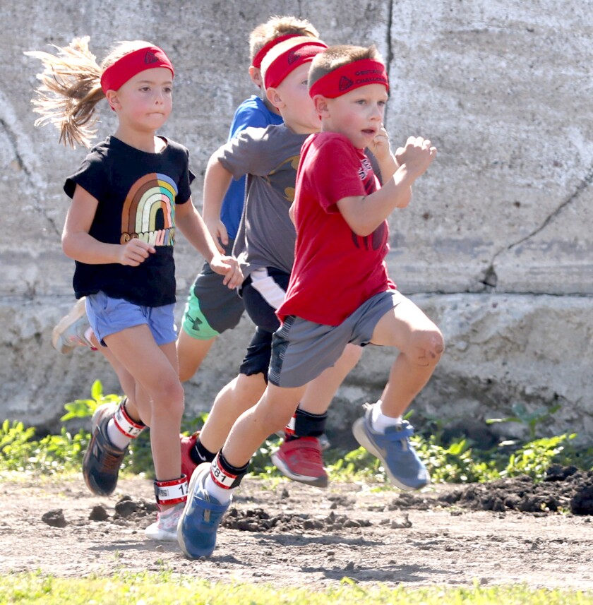 Runners age 5 through 7 compete in the second heat of the TriForHealth obstacle run during the Jackson County Fair Saturday at the Jackson Motorplex.