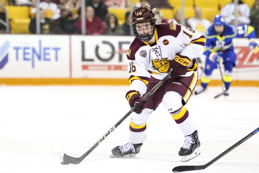 college men play ice hockey