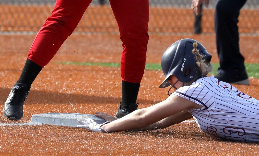 Superior’s Melania Luostari (33) slides safely into third base