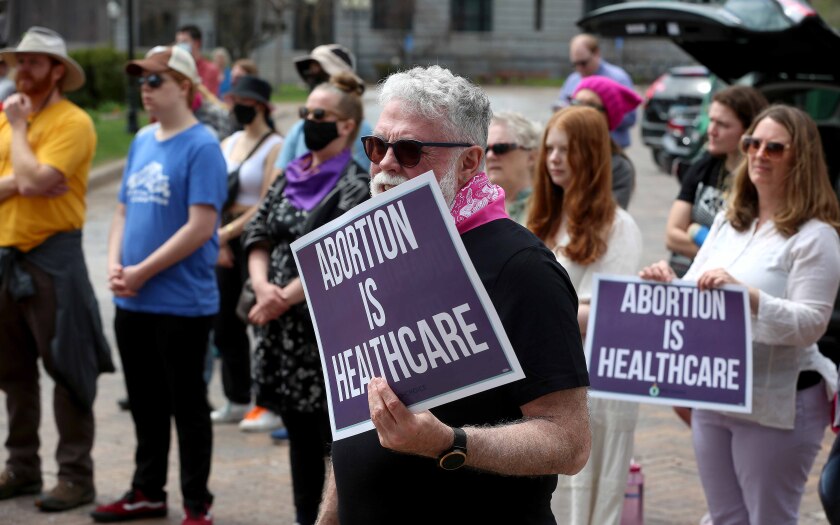 A man holds up a sign during a protest