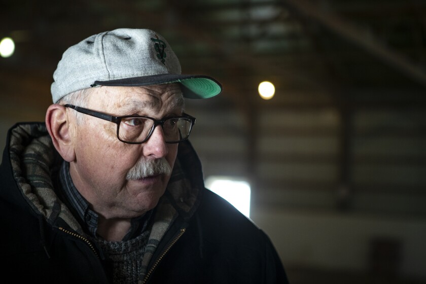 Dr. Allen Balay pauses for a moment while walking by his business, the New London Equestrian Center, on Minnesota's Highway 23, Thursday, March 10, 2022. Balay was recently named Vet of the Year by the Minnesota Veterinary Medical Association.