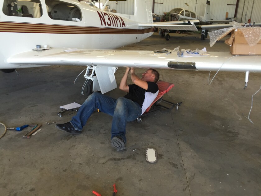 Shelby Lindrud / TribunePaul Beck, owner of Weep No More, finishes up work on one of five planes currently in his hangar at the Willmar Airport. Beck and business partner Eric Rudningen were chosen as the next fixed-base operator at the airport, contingent on an approved contract with the city.