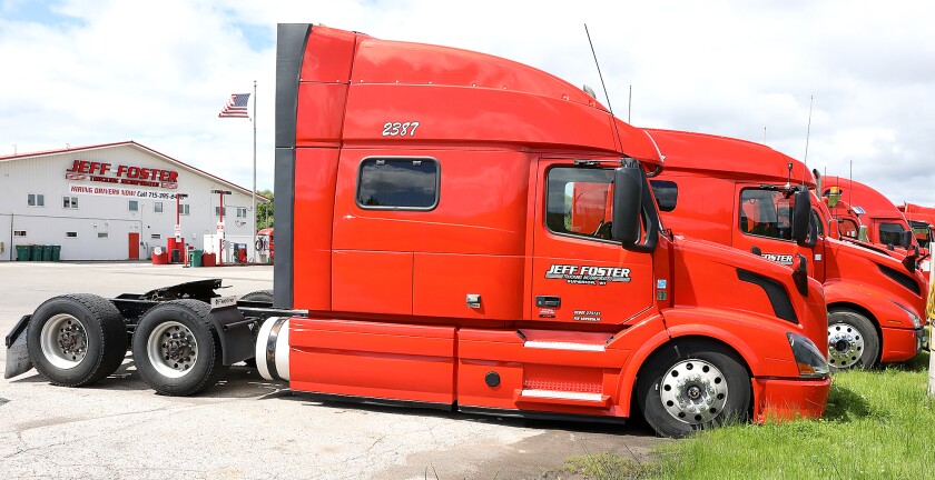Semi-trailer trucks are parked outside of Jeff Foster Trucking headquarters in Superior