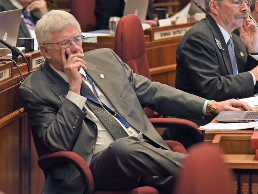 Rep. Pam Anderson, D-Fargo, is a supporter of Senate Bill 2344, the medical marijuana bill. She is highlighting significant differences in SB2344 and the initiated measure passed by voters at her desk in the House chamber in the state Capitol in Bismarck. Tom Stromme / Bismarck Tribune
